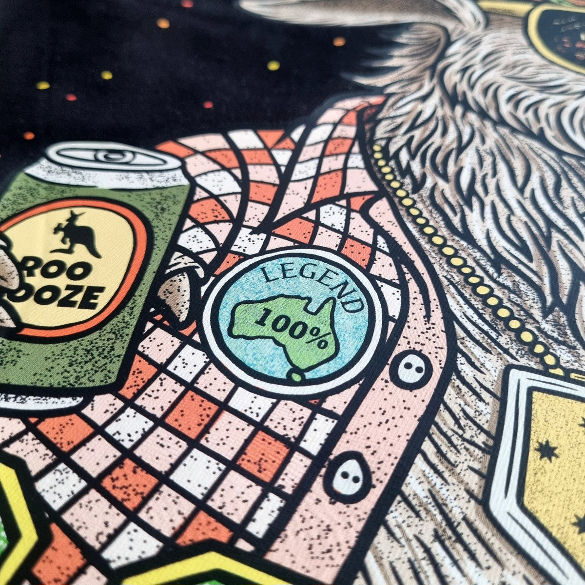 Colorful graphic design with 'Roo Booze' can and 'Legend 100%' badge on a patterned background